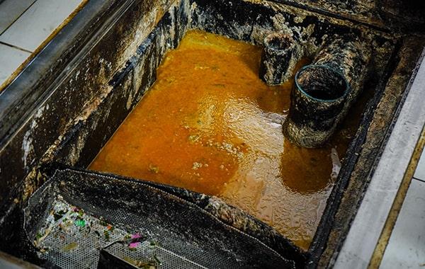 putting off grease trap cleaning can result in clogs, foul odors, and even fines from local authorities